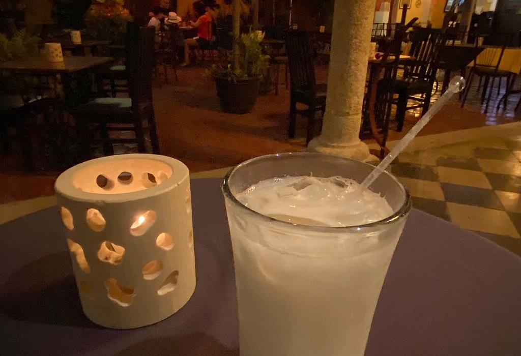 traditional horchata drink in Yucatan served cold in a glass at a restaurant in Merida Mexico