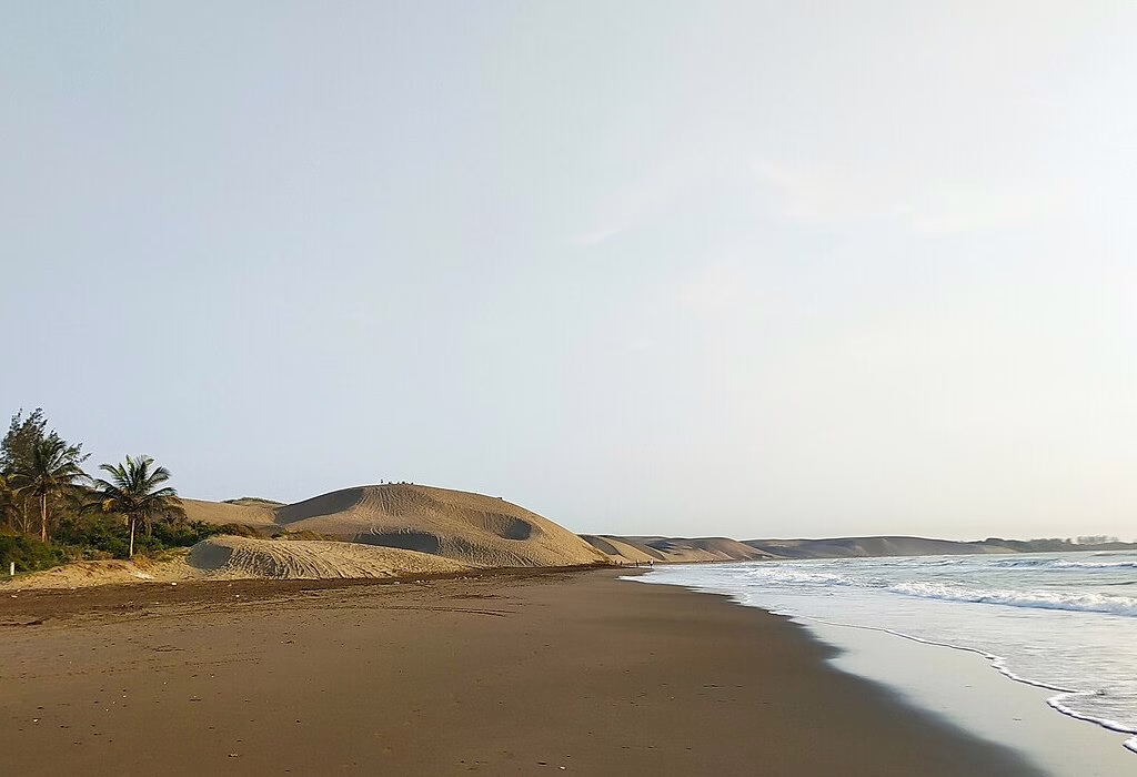 Vast sand dunes meeting the ocean at Chachalacas Beach in Veracruz, a unique landscape among the hidden beaches in Mexico.