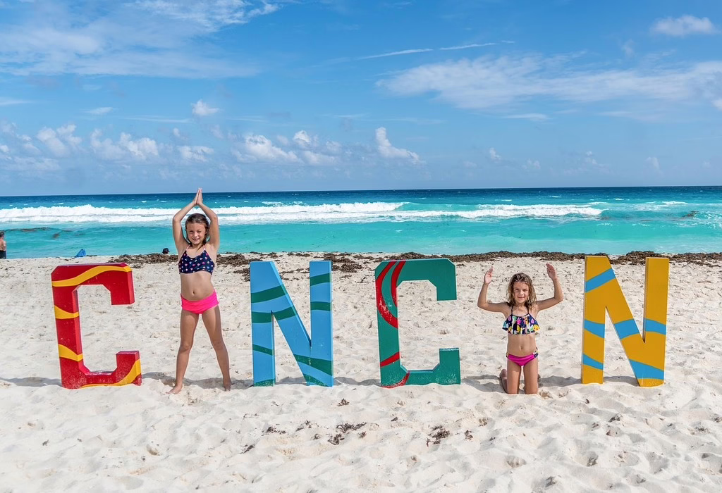 Children enjoying a safe family beach experience in Cancun, one of the safest destinations in Mexico