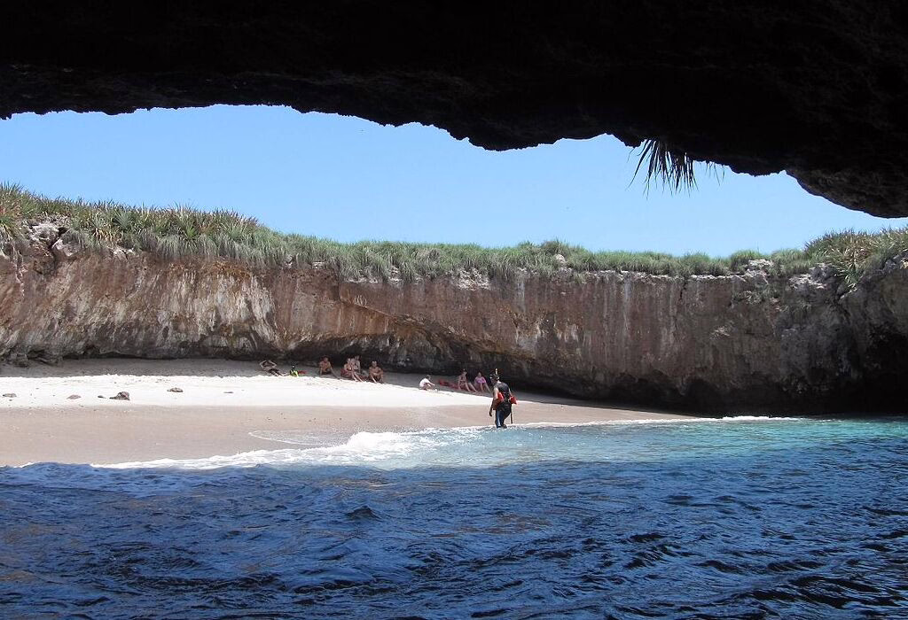 Visitors entering the Hidden Beach at Marietas Islands near Puerto Vallarta through the natural opening of the volcanic crater