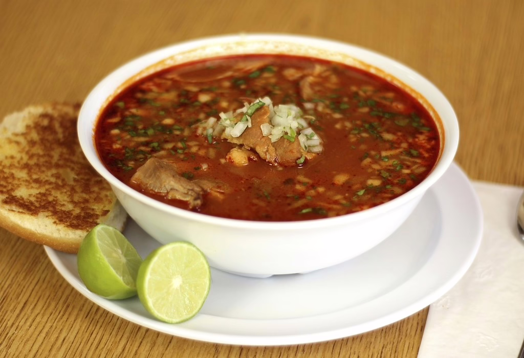 Bowl of red soup with meat