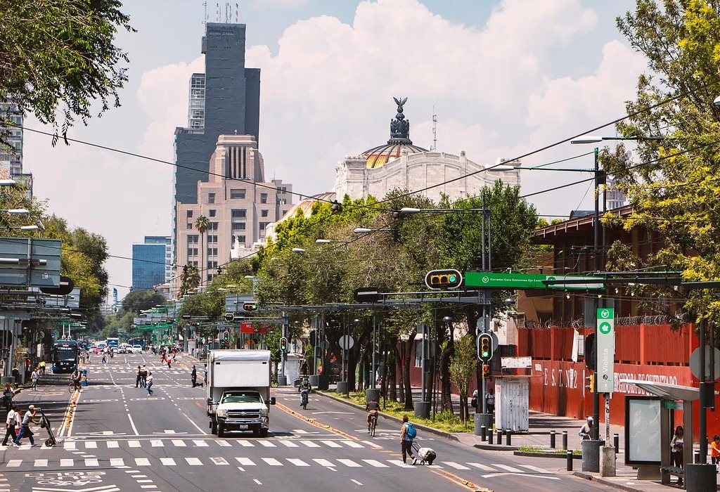 A view down a busy avenue in Mexico City's historic center, illustrating that Mexico City is safe for daily navigation.